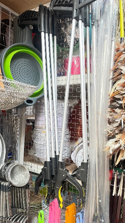 Trash grabber arm